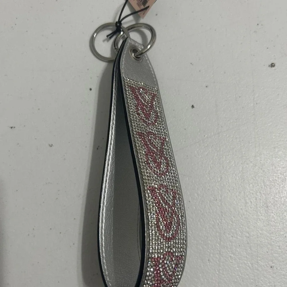 Victoria's Secret pink & silver rhinestone keychain with repeating V-shaped